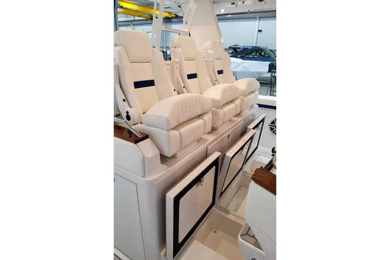 Slide: The Image of 2026 Formula 457 Center Console Fish boat with luxurious white seating and storage compartments. - 39