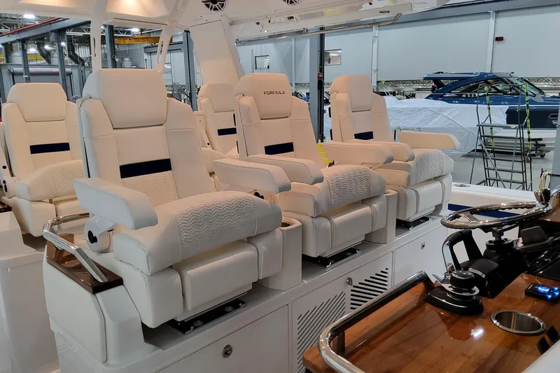 Slide: The Image of Luxurious seating on 2026 Formula 457 Center Console Fish boat in a showroom. - 41