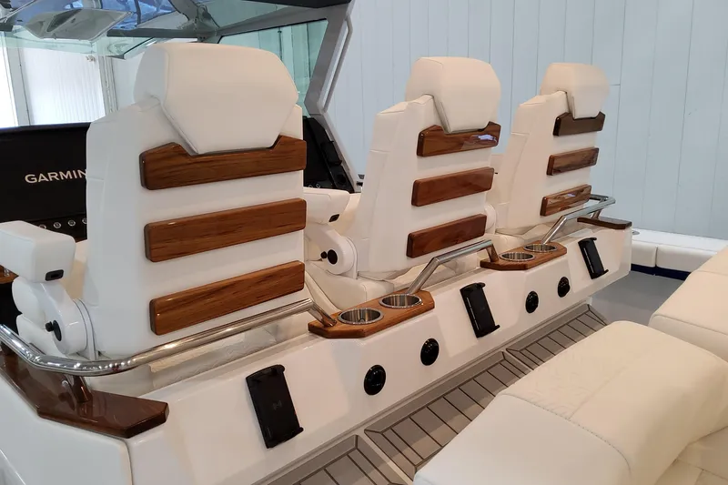 Slide: The Image of 2026 Formula 457 Center Console Fish boat interior with luxurious seating and wood accents. - 43