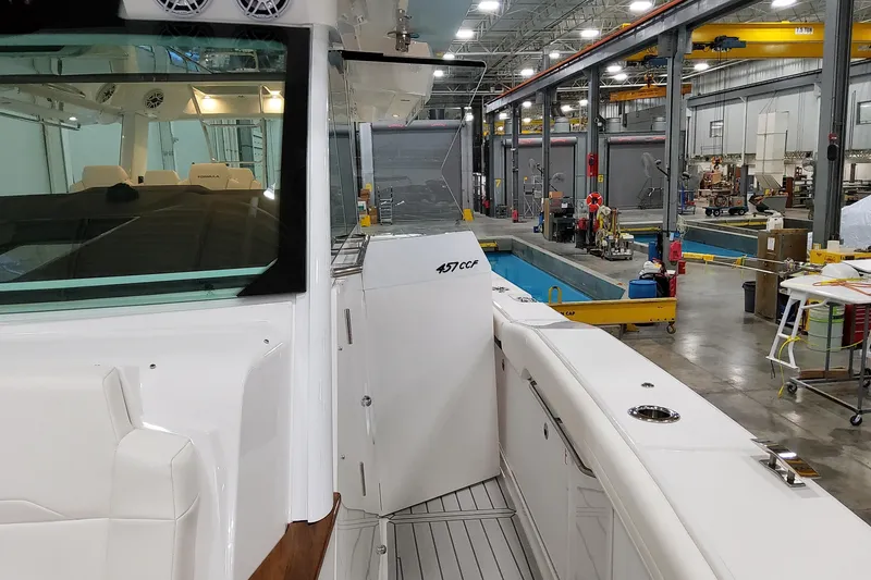 Slide: The Image of 2026 Formula 457 Center Console Fish boat in a manufacturing facility. - 48