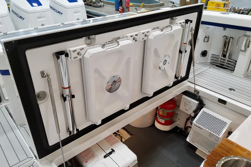 Slide: The Image of 2026 Formula 457 Center Console Fish boat interior with Mercury engines and storage compartments. - 5