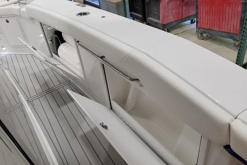 Slide: The Image of 2026 Formula 457 Center Console Fish boat interior with open storage compartments. - 50