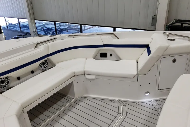 Slide: The Image of 2026 Formula 457 Center Console Fish boat interior with white seating and blue accents. - 53