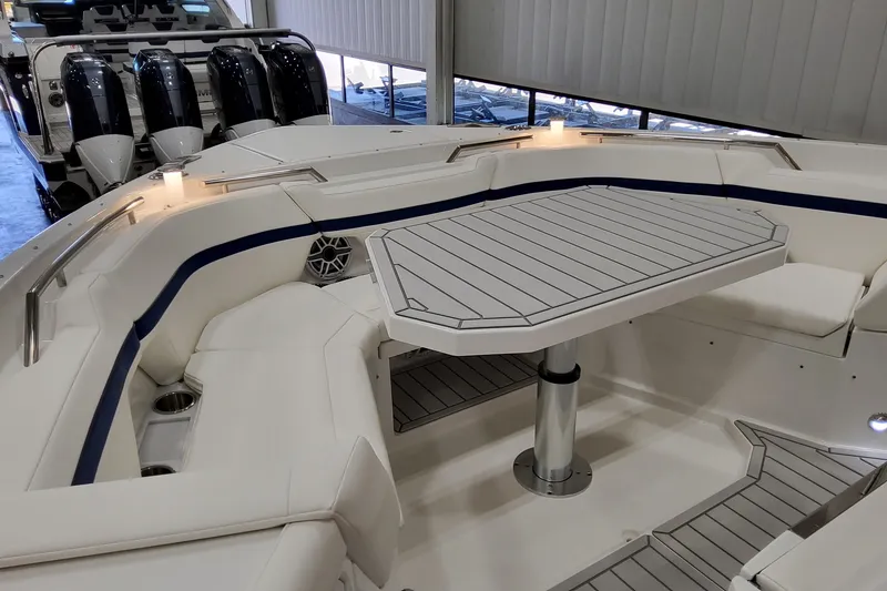 Slide: The Image of 2026 Formula 457 Center Console Fish boat interior with seating and table, showcasing luxury design. - 58