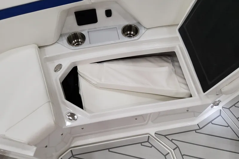 Slide: The Image of 2026 Formula 457 Center Console Fish boat interior with storage compartment and cup holders. - 62