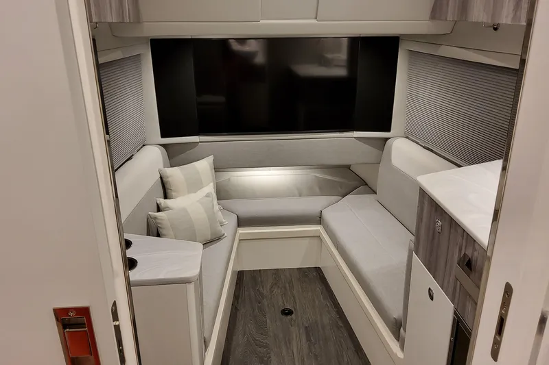 Slide: The Image of Interior of 2026 Formula 457 Center Console Fish, featuring modern seating and a large TV. - 71