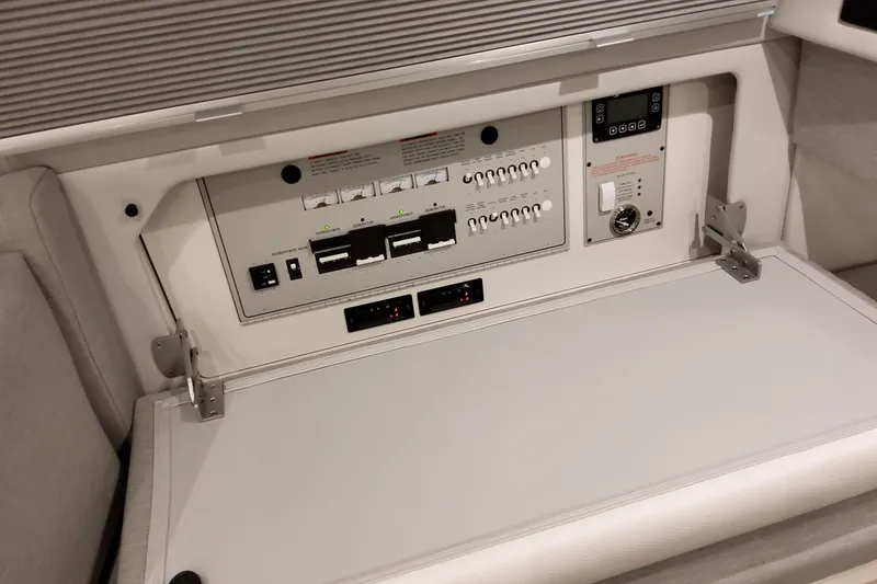 Slide: The Image of Control panel of 2026 Formula 457 Center Console Fish boat, featuring switches and indicators. - 73