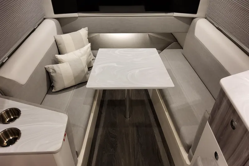 Slide: The Image of 2026 Formula 457 Center Console Fish interior with modern seating and table. - 75