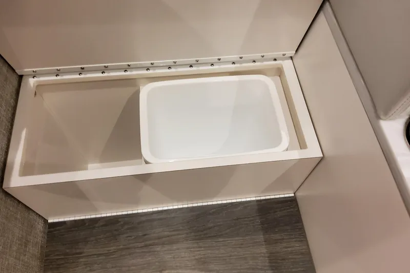 Slide: The Image of Storage compartment in 2026 Formula 457 Center Console Fish boat interior. - 86