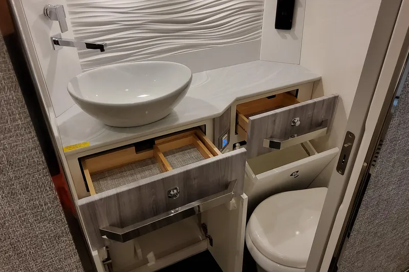 Slide: The Image of Modern bathroom interior in 2026 Formula 457 Center Console Fish boat, featuring sleek sink and storage. - 87