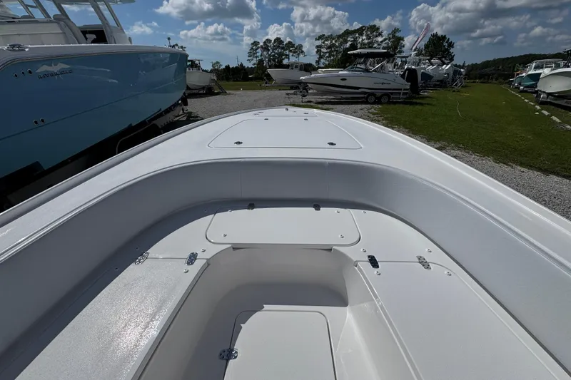 Slide: The Image of 2026 Contender 26 Bay boat interior, showcasing spacious deck and storage compartments. - 15