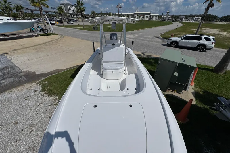 Slide: The Image of 2026 Contender 26 Bay boat on display, featuring sleek design and spacious deck. - 18