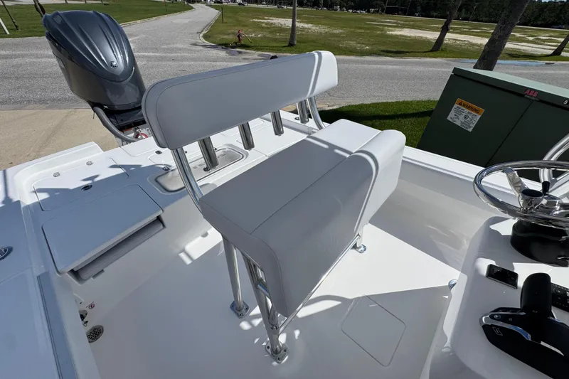 Slide: The Image of 2026 Contender 26 Bay boat interior with seating and steering wheel. - 30