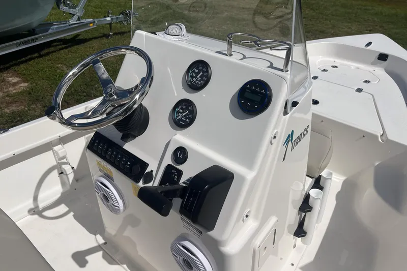 Slide: The Image of 2026 Key West 1720 Center Console boat dashboard with steering wheel and gauges. - 12