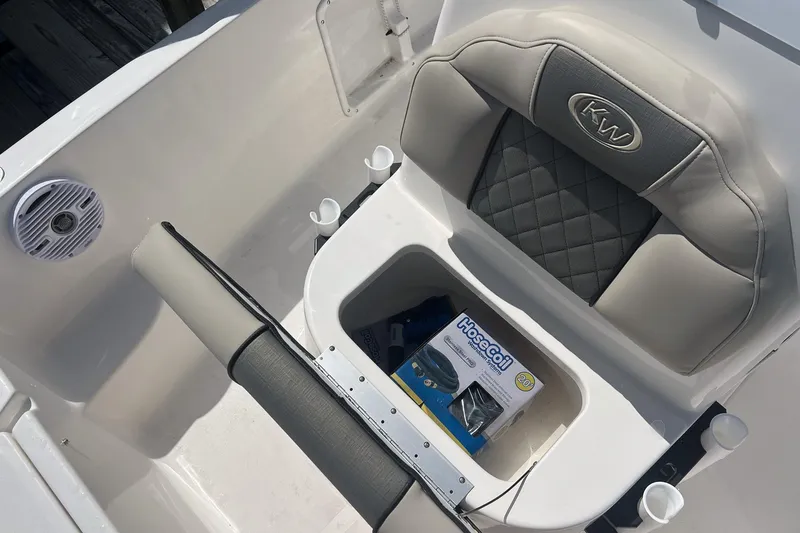 Slide: The Image of 2026 Key West 1720 Center Console boat interior with storage and speaker. - 17