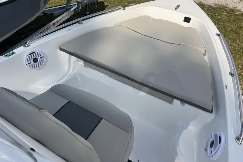 Slide: The Image of 2026 Key West 1720 Center Console boat interior with cushioned seating and speakers. - 6