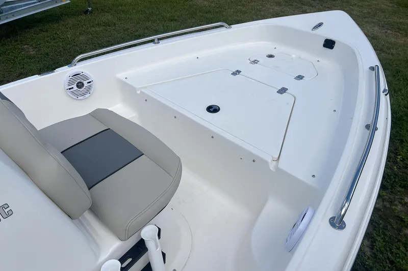 Slide: The Image of 2026 Key West 1720 Center Console boat interior with seating and storage. - 8