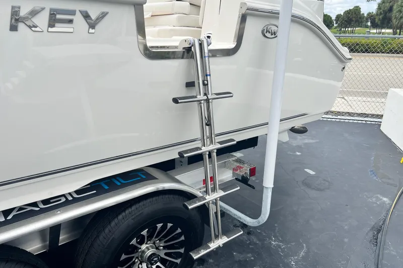 Slide: The Image of 2026 Key West 291 FS boat on trailer with stainless steel ladder. - 10