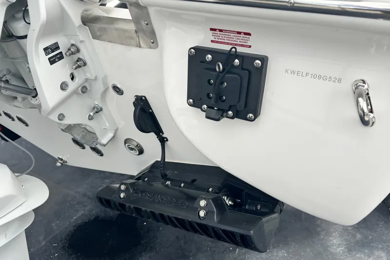 Slide: The Image of 2026 Key West 291 FS boat transom with mounted equipment and serial number. - 11