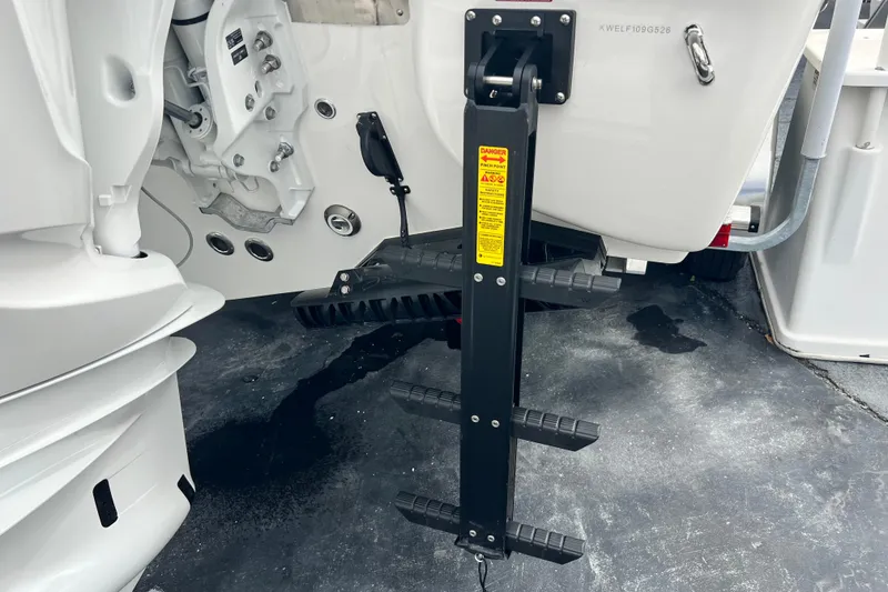 Slide: The Image of Rear view of 2026 Key West 291 FS boat with a foldable ladder. - 12