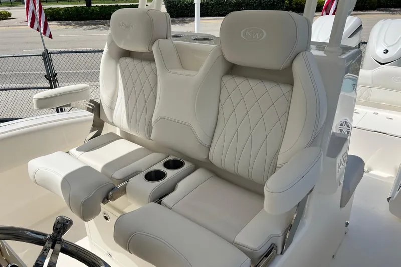Slide: The Image of Luxurious seating on 2026 Key West 291 FS boat with cup holders and armrests. - 16