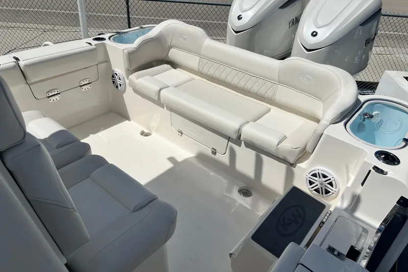 Slide: The Image of 2026 Key West 291 FS boat interior with white seating and modern features. - 17