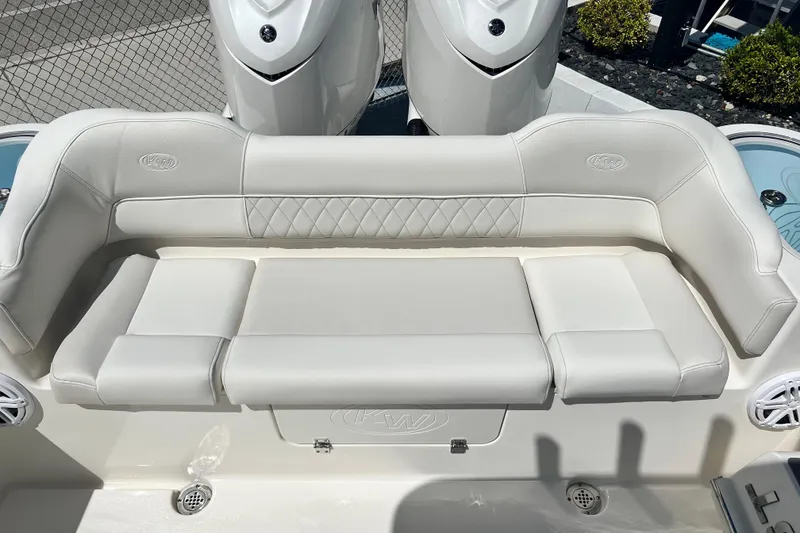 Slide: The Image of 2026 Key West 291 FS boat with luxurious white seating and dual engines. - 18
