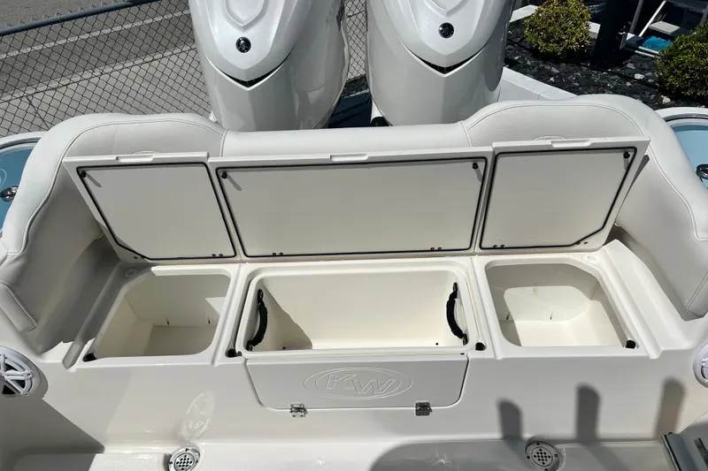 Slide: The Image of 2026 Key West 291 FS boat storage compartments with open lids, showcasing spacious interior. - 20