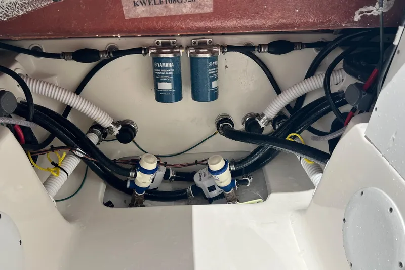Slide: The Image of Engine compartment of 2026 Key West 291 FS boat with Yamaha fuel filters and hoses. - 22