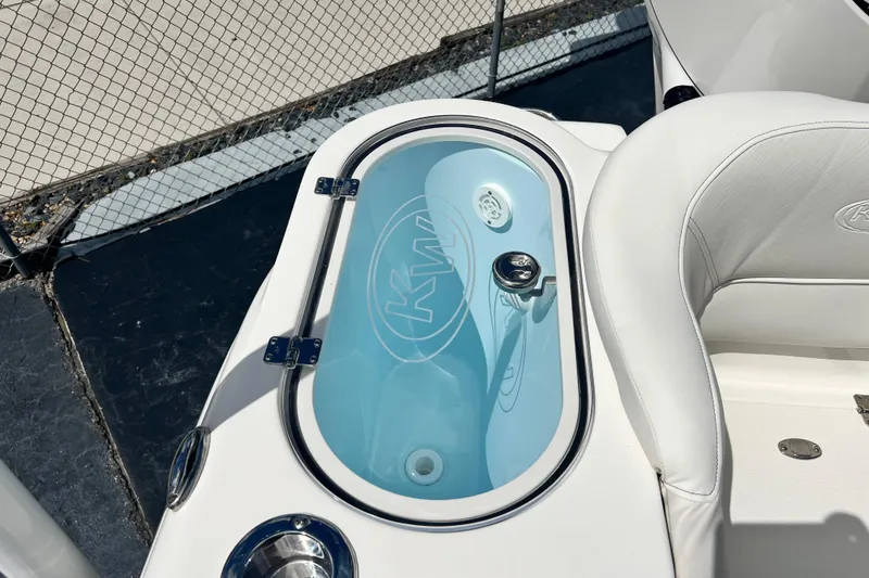 Slide: The Image of Livewell on 2026 Key West 291 FS boat, featuring sleek white seating and modern design. - 23