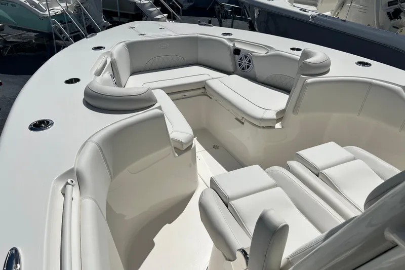 Slide: The Image of 2026 Key West 291 FS boat interior with white cushioned seating and sleek design. - 25