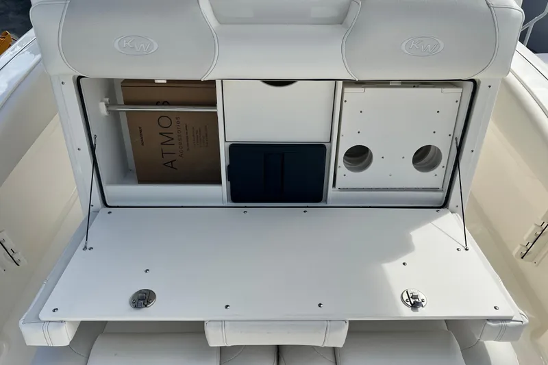 Slide: The Image of 2026 Key West 291 FS boat interior with storage compartments and seating. - 35