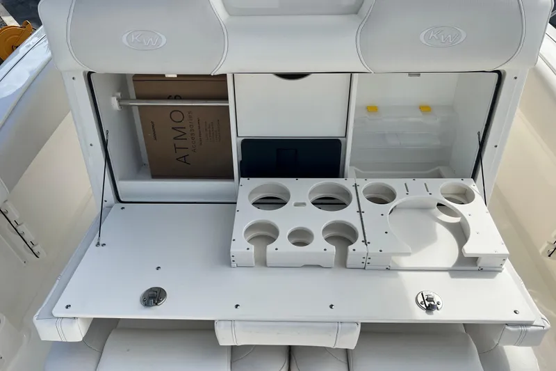 Slide: The Image of 2026 Key West 291 FS boat interior with storage compartments and cup holders. - 36