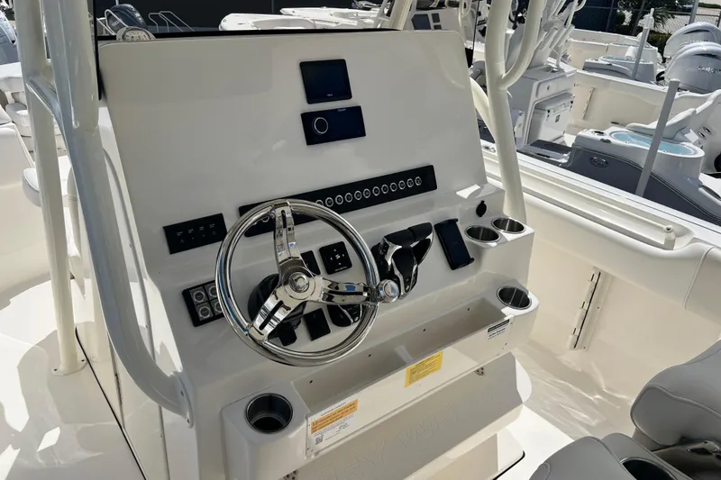 Slide: The Image of 2026 Key West 291 FS boat dashboard with steering wheel and controls. - 39
