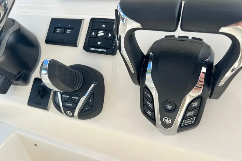 Slide: The Image of 2026 Key West 291 FS boat controls with joystick and throttle levers. - 41