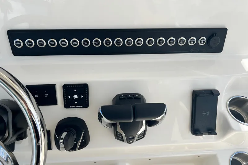 Slide: The Image of Control panel of 2026 Key West 291 FS boat with various switches and controls. - 42