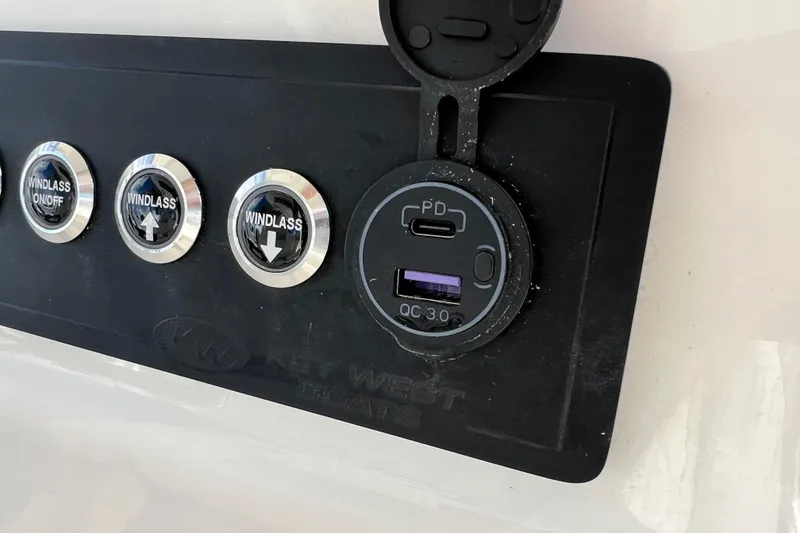 Slide: The Image of Control panel of 2026 Key West 291 FS boat with USB ports and windlass buttons. - 44