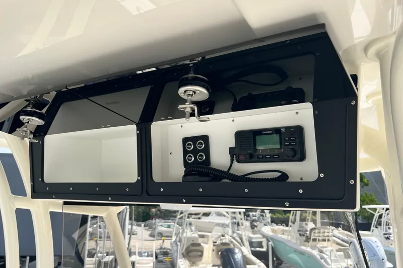 Slide: The Image of 2026 Key West 291 FS boat console with Garmin radio and control panel. - 45
