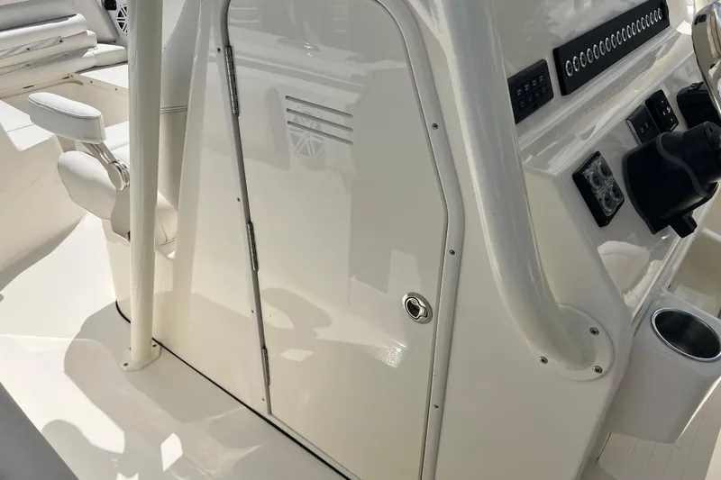 Slide: The Image of 2026 Key West 291 FS boat console with steering wheel and control panel. - 48