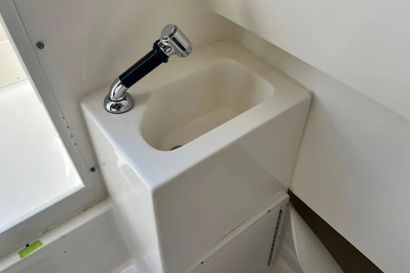 Slide: The Image of Compact sink with chrome faucet in 2026 Key West 291 FS boat interior. - 50