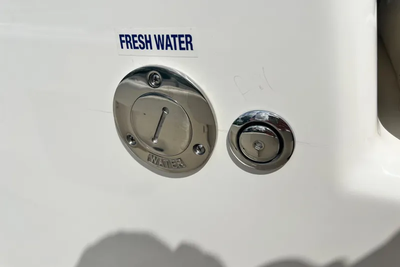 Slide: The Image of Fresh water access on 2026 Key West 291 FS boat, featuring stainless steel fittings. - 52