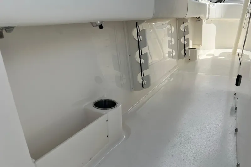 Slide: The Image of 2026 Key West 291 FS boat interior with rod holders and cup holder. - 53