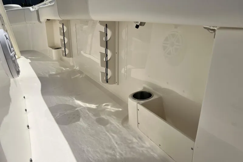 Slide: The Image of 2026 Key West 291 FS boat interior with rod holders and cup holder. - 54