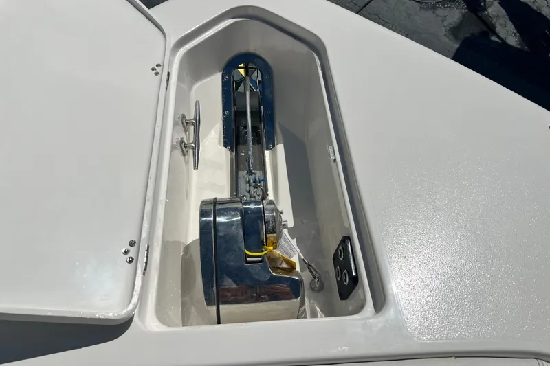 Slide: The Image of Anchor compartment of 2026 Key West 291 FS boat, featuring a modern winch system. - 55