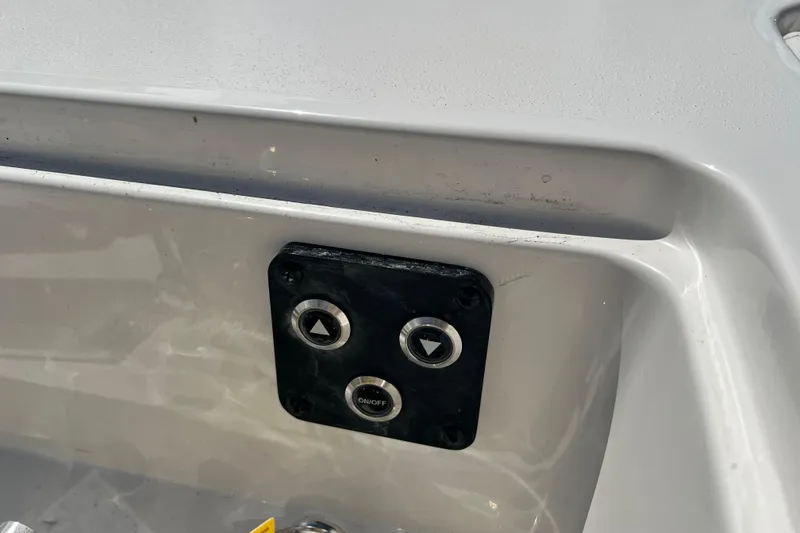 Slide: The Image of Control panel on a 2026 Key West 291 FS boat, featuring up and down buttons. - 56