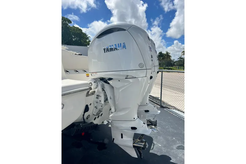 Slide: The Image of 2026 Key West 291 FS boat with Yamaha outboard motors, parked outdoors. - 6