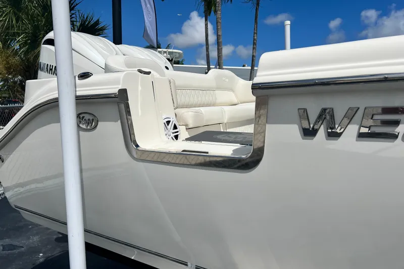 Slide: The Image of 2026 Key West 291 FS boat, sleek design, white exterior, luxurious seating, sunny day. - 8