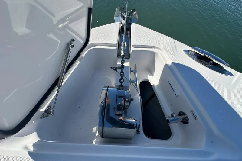 Slide: The Image of Anchor system on 2015 Edgewater 320CC boat, featuring a stainless steel windlass. - 24