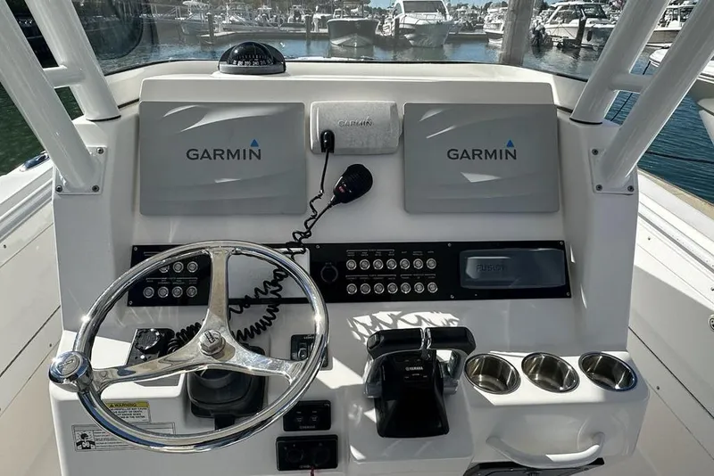 Slide: The Image of Control panel of 2015 Edgewater 320CC boat with Garmin navigation system. - 8
