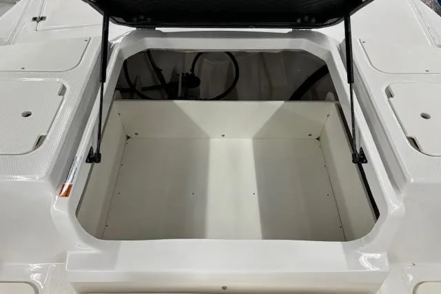 Slide: The Image of 2024 Chaparral 19 SSi OB boat storage compartment, open and empty. - 13